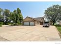 Spacious detached three-car garage with a large driveway and ample parking at 1314 Highway 66, Longmont, CO 80504
