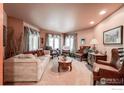Cozy living room with plush seating, large windows, and elegant decor at 1314 Highway 66, Longmont, CO 80504