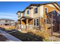 Attractive two-story home with beautiful stonework and manicured front yard at 13725 Ash Cir, Thornton, CO 80602