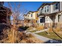 Street view of well maintained homes with front lawns and nice landscaping at 13725 Ash Cir, Thornton, CO 80602