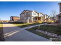 Well-kept exterior view of home with nice front yard and sidewalk at 13725 Ash Cir, Thornton, CO 80602