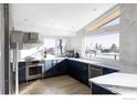 Modern kitchen featuring stainless steel appliances, sleek blue cabinets, and a bright, airy design at 3590 Longwood Ave, Boulder, CO 80305
