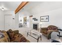Bright living room with a fireplace, exposed beam, and an open layout at 5520 Stonewall Pl # 31, Boulder, CO 80303