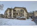 Chateau Montaigne Condominiums featuring private balconies and snow-covered shrubs at 625 Manhattan Pl # 308, Boulder, CO 80303