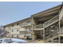 View of exterior balconies featuring stairs, railing, and minimal snow cover at 625 Manhattan Pl # 308, Boulder, CO 80303