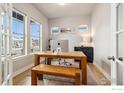 Bright home office with a large window, wooden desk, and stylish decor at 6334 N Dayton Way, Denver, CO 80238