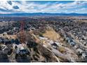 Wide aerial shot of a home in a neighborhood with mountain views at 1002 Willow Ct, Longmont, CO 80503