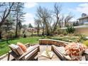 Relaxing backyard with stone patio, perfect for outdoor entertaining at 1516 Columbine Ave, Boulder, CO 80302