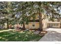 Spacious home with mature trees, lush lawn, and a detached garage at 1516 Columbine Ave, Boulder, CO 80302