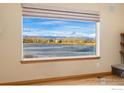 Beautiful mountain and lake view from a large picture window at 1646 Harris Ct, Erie, CO 80516