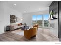 Bright living room with modern furnishings, fireplace, and access to a balcony with mountain views at 2611 Westview Way, Superior, CO 80027