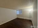 Bright bedroom with a large window and hardwood flooring at 2707 Valmont Rd # 111A, Boulder, CO 80304