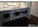 Breakfast bar with sleek stools and a view into the kitchen at 2707 Valmont Rd # 111A, Boulder, CO 80304