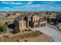 Expansive aerial view of the home highlighting the lush landscaping, exterior architecture, and neighborhood at 3214 Timeless Trl, Berthoud, CO 80513