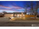 Charming single-story home featuring a spacious front yard and attached two-car garage at 3545 W 132Nd Pl, Broomfield, CO 80020