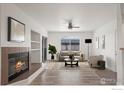 Bright living room featuring a fireplace, neutral tones, and natural light at 710 Copper Ln # 102, Louisville, CO 80027