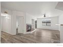 Open living room design with fireplace and a large window for natural light at 710 Copper Ln # 102, Louisville, CO 80027