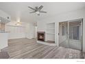 Spacious living room featuring a ceiling fan and a sliding glass door at 710 Copper Ln # 102, Louisville, CO 80027
