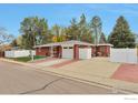 Beautiful brick home with a spacious driveway and attached one-car garage at 1211 16Th Ave, Longmont, CO 80501