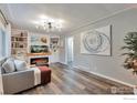 Cozy living room with built-in bookshelves, fireplace, and modern decor at 1211 16Th Ave, Longmont, CO 80501