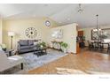 Bright living room with stylish furniture and a vaulted ceiling, perfect for relaxation at 1749 Foster Dr, Longmont, CO 80501