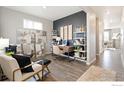Stylish home office featuring a modern desk, elegant decor, and comfortable seating area at 1836 Westport Ave, Berthoud, CO 80513