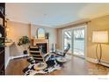 Cozy living room with a fireplace, stylish seating, and a sliding glass door at 275 Pearl St # 11, Boulder, CO 80302