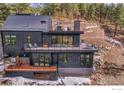 Contemporary home with multiple decks, offering great outdoor living spaces at 365 Bow Mountain Rd, Boulder, CO 80302