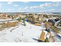 Aerial view from the back, with a nice deck, patio and sport court at 4873 Desperado Way, Parker, CO 80134
