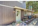 Inviting front porch with charming decor and a welcoming entrance at 1055 Ponderosa Cir, Longmont, CO 80504