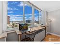 A bright workspace with city views and a modern desk at 1196 N Grant St # 710, Denver, CO 80203