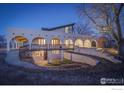 Spacious home showcasing a large, arched porch and unique architectural design at 1866 Park Lake Dr, Boulder, CO 80301