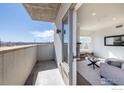 Balcony with partial view to living room, offers outdoor space and natural light at 3301 Arapahoe Ave # 316, Boulder, CO 80303