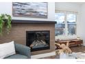 Living room featuring a fireplace, comfortable seating, and view of the mountains at 3301 Arapahoe Ave # 316, Boulder, CO 80303