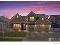 Stunning two-story home with a three-car garage and beautiful stone accents at 386 Painted Horse Way, Erie, CO 80516