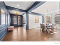 Home foyer with hardwood floors and view of dining area at 386 Painted Horse Way, Erie, CO 80516