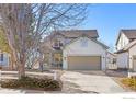 Beautiful two-story home with attached two-car garage, well-maintained lawn, and attractive landscaping at 4007 Sandcherry Pl, Longmont, CO 80503