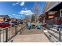 Inviting front yard setup with cozy seating around a modern fire pit at 4100 Eliot St, Denver, CO 80211