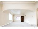 Bright living room featuring fresh carpet and an open layout at 4100 Eliot St, Denver, CO 80211