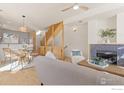 Bright living room features a fireplace with tile detail and hardwood floors at 4653 14Th St, Boulder, CO 80304