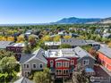 Beautiful aerial view of colorful townhomes with mountain views in the background under a clear, blue sky at 4714 16Th St, Boulder, CO 80304