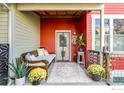 Inviting front porch with comfortable seating and a decorative rug at 4714 16Th St, Boulder, CO 80304