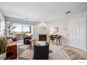 Inviting living room with fireplace, modern decor, and access to the outdoor balcony at 4985 Twin Lakes Rd # 95, Boulder, CO 80301