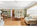 Inviting living room featuring hardwood floors, lots of light, and neutral decor at 6 Sunset Cir, Longmont, CO 80501