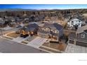 An aerial view of a charming home nestled in a peaceful neighborhood with mountain views at 684 Biscayne Ct, Berthoud, CO 80513