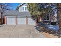 Charming two-story house with three-car garage and brick accents at 11563 W 67Th Ave, Arvada, CO 80004