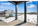 Covered patio with view of a construction site and surrounding neighborhood at 1525 E 3Rd Ave, Longmont, CO 80501