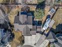 Overhead view of a well-maintained property with lush landscaping, RV parking, and a charming outdoor space at 1826 Little Bear Ct, Longmont, CO 80504