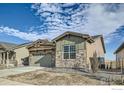 This house has an attached garage, and is stone paved on the bottom half with siding on the upper portion at 2978 Newfound Lake Rd, Berthoud, CO 80513