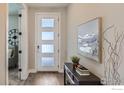 Inviting foyer features stylish console table and decor at 2978 Newfound Lake Rd, Berthoud, CO 80513